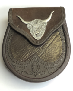 Highland cow emblem mounted on leather sporran; Made in Scotland for Scottish Treasures