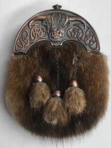 Chocolate bronze highland cow cantle with dark brown beaver fur. Scottish Treasures